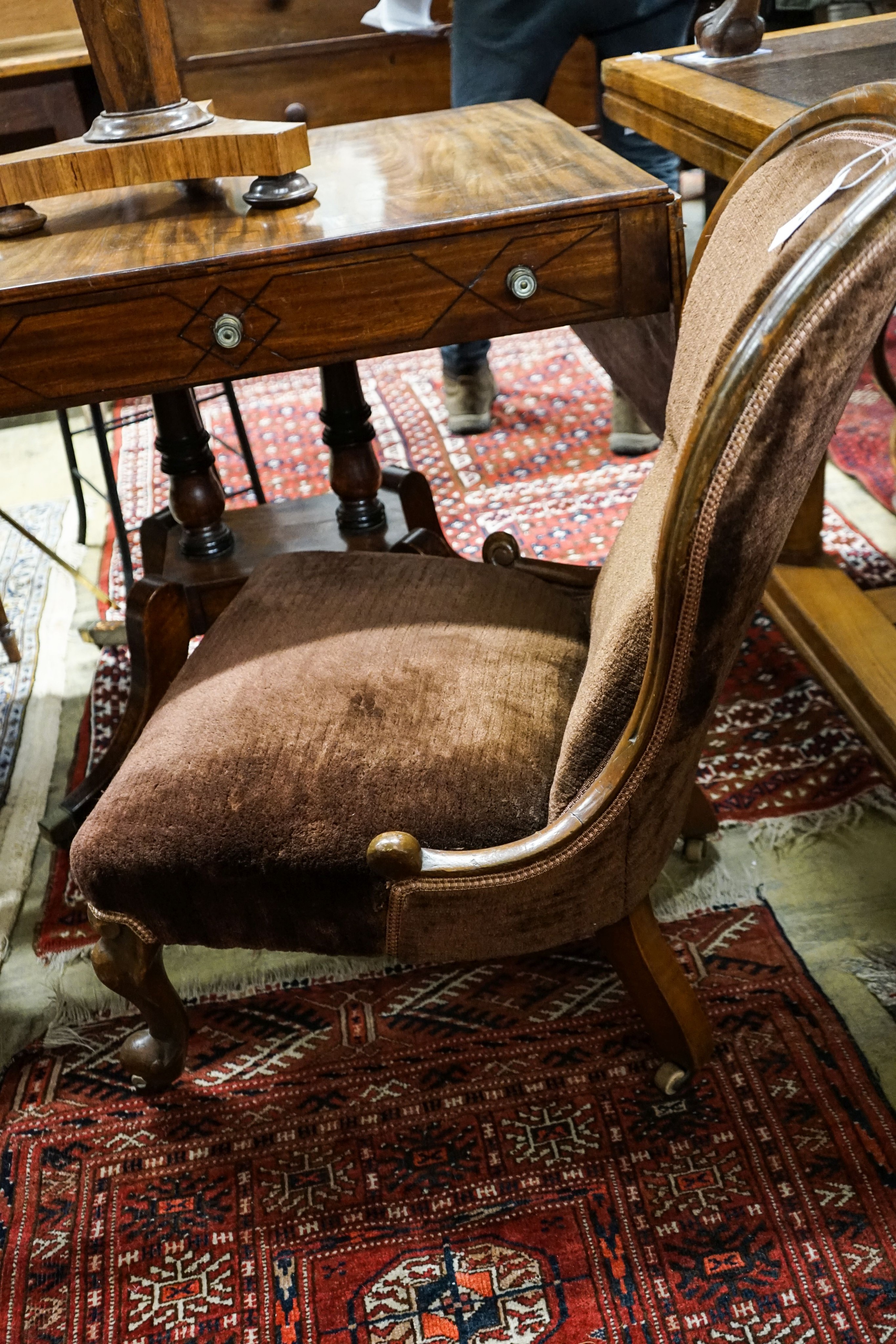 A Victorian mahogany spoonback nursing chair